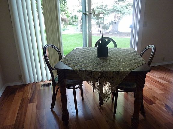 Dining room
						:
						Hardwood floor in dining room and entrance