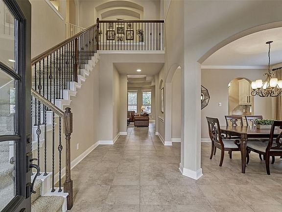 As you enter through the lovely front door you are greeted with soaring ceilings and lots of natural light!