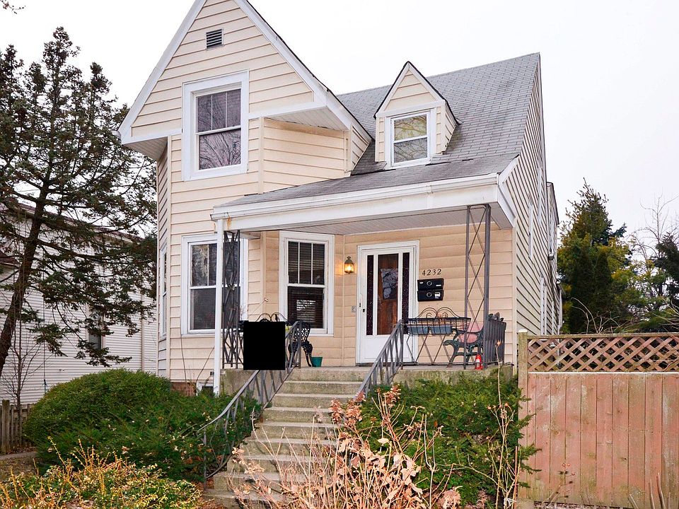 Front Exterior and Vacant Side Lot