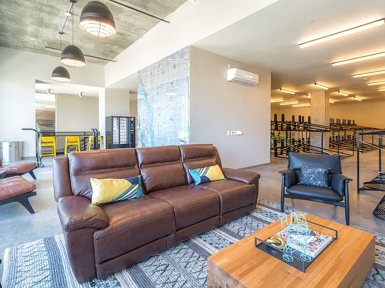 Lounge with leather seating and industrial-style accents.