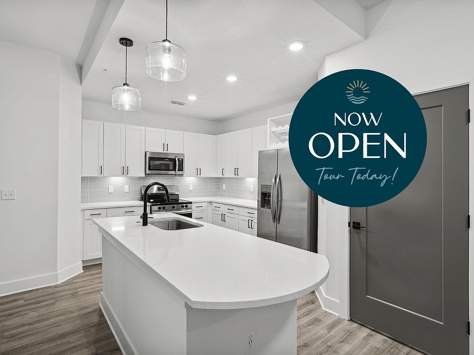 Kitchen with Quartz Countertop and Stainless Steel Appliances.