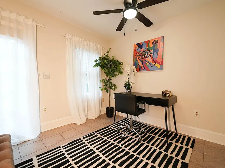 3rd bedroom with door to the outdoor patio