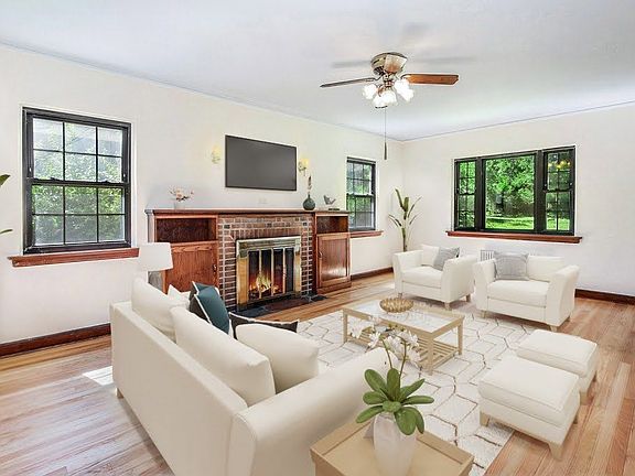 Virtually staged living room w/ fireplace