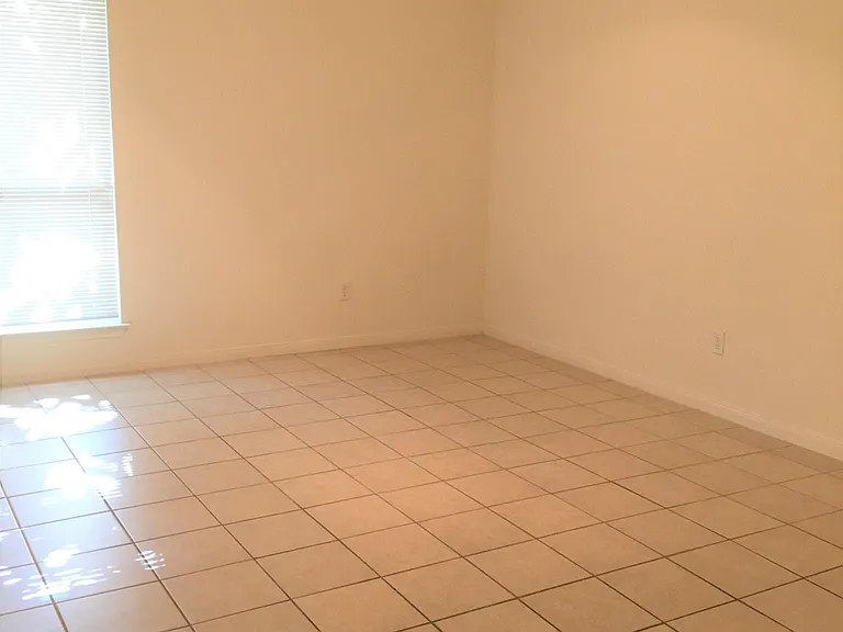Spacious master suite with ceiling fan, walk-in closet, its own bathroom