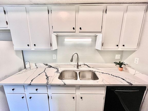 Brand new quartz counters with undermount stainless steel sink