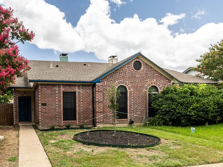 Front of home, the unit is on the left.
