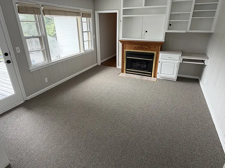 Study w/ gas fireplace. Connected to back deck & kitchen.