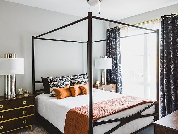 Comfortable bedroom with large windows