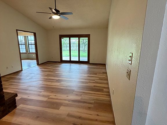 Entryway leads to living room. Hallway to bedrooms and bathrooms is on the right.