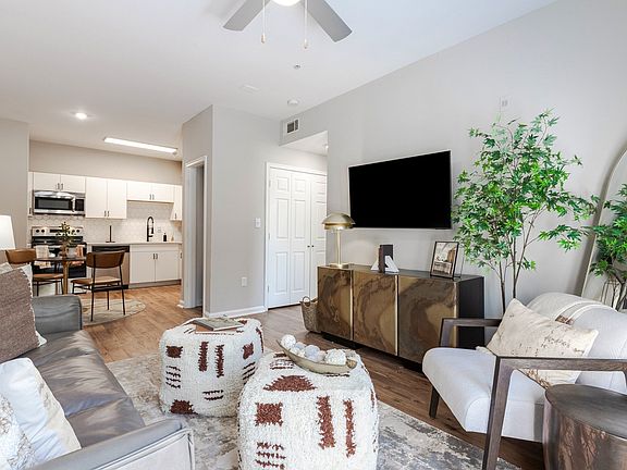 Newly Renovated Living Room with Hardwood-Style Flooring