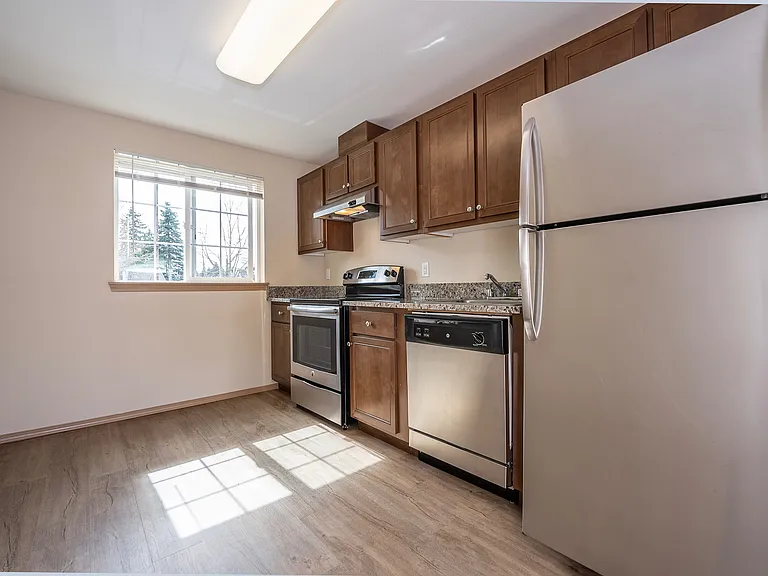 Experience culinary delight in this well-lit kitchen equipped with sleek appliances. Experience culinary delight in this well-lit kitchen equipped with sleek appliances.