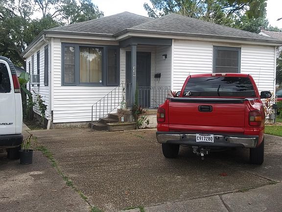 Where the red truck is parked, there is plenty room for 2 vehicles. -- at least there is when cars are parked parallel to each other & to Saint George. Additionally, where the white van is parkedthere's a side driveway -- access the home through a side t