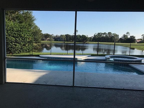 Walk in front door to an expansive living area over looks, pool, pond, and golf course. Brightly lighted and cheerfully painted. New wood working and crown molding throughout home.