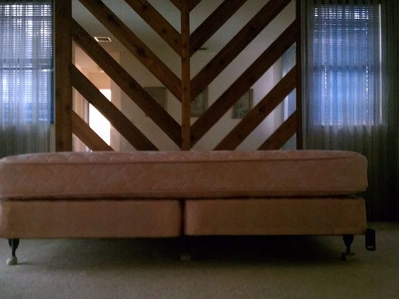 Welcome to the 70's!! Original headboard in master bedroom