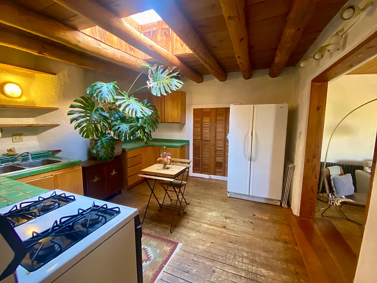 If desired, move the 4-person round dining table back into the kitchen. I adore this island-like cafe table for morning coffee.