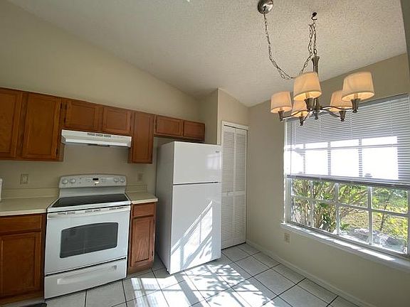 Kitchen new appliance and light fixture