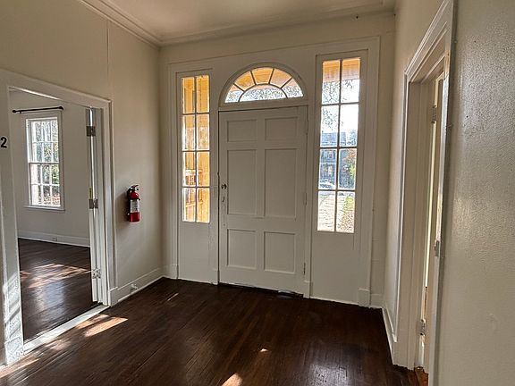 This is a quadplex with entry and parking in the back or street parking.