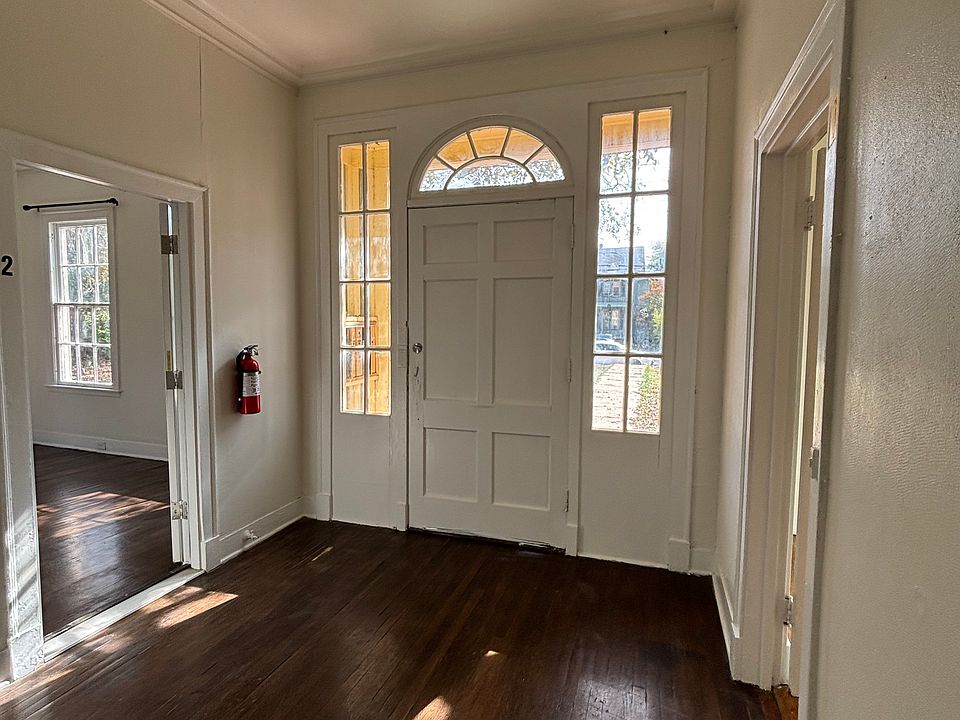 This is a quadplex with entry and parking in the back or street parking.