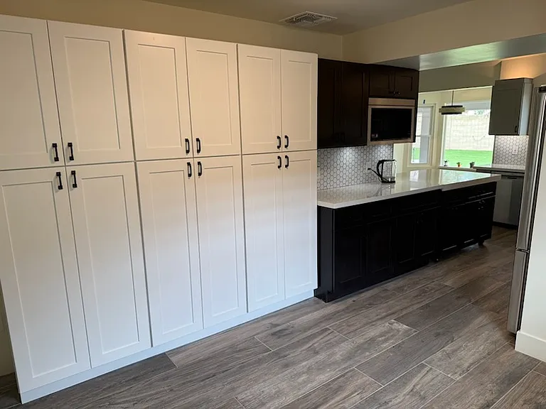 "Scullery Kitchen (Back Kitchen) has loads of cabinets and makes for a perfect crafting area with natural lighting plus overhead lighting