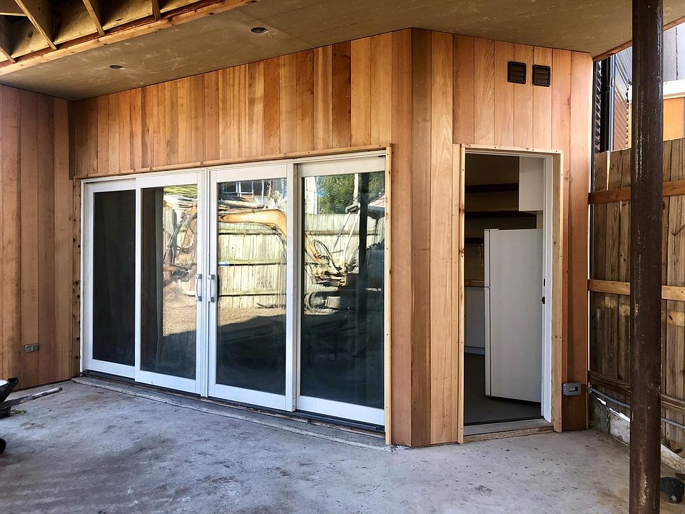 View from entry into the residence from the street. Roll up garage door behind the person taking the photo.