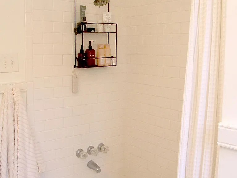 Renovated Bathroom with Marble Vanity in Charming 2 BDR/1 BA Retro Row Duplex Apartment.