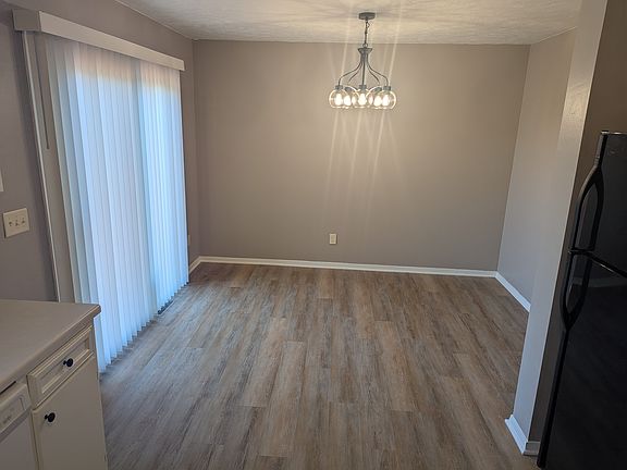 Dining Area with chandelier and patio door to back yard and deck
