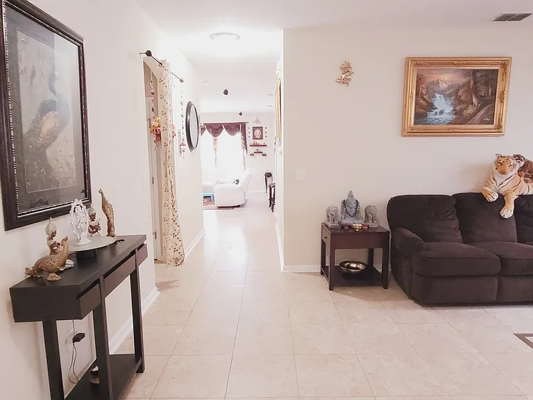 Sample View of the home from Garage Entrance with furniture staged.