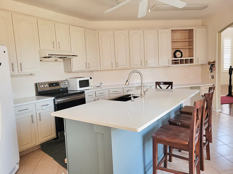 central work space -provides plenty of room for large family entertainment - over look garden - adjacent to living room