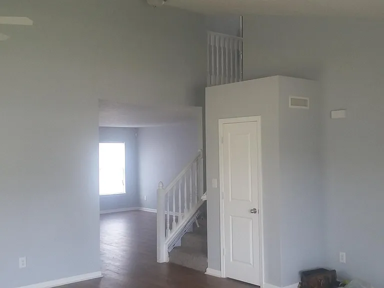 STAIRS AND LIVING ROOM CLOSET