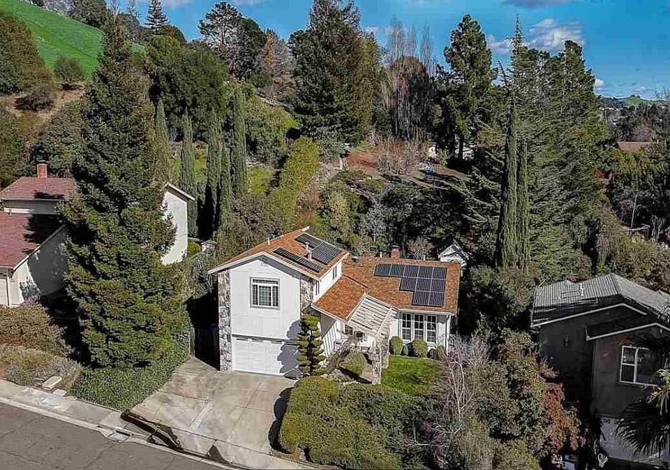 View of property with expansive back yard. The rental is the separate 1-bedroom in-law apartment upstairs.