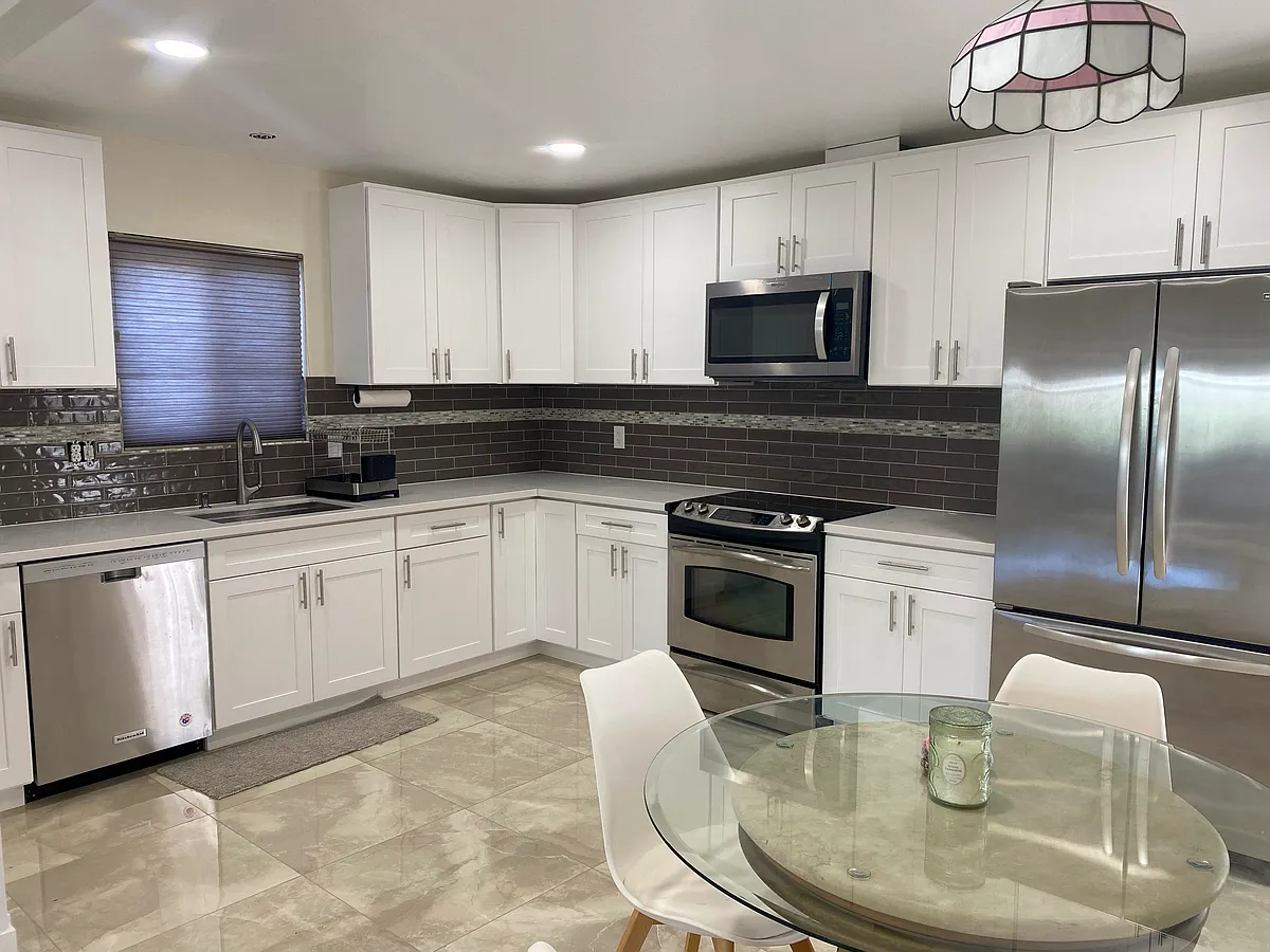 new kitchen cabinets and stainless steel appliances - 5031 Genesee Ave