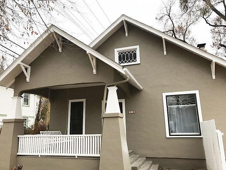 Front view with Covered front porch and swing.