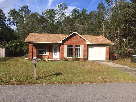 Wooded lots behind and to right of house.
