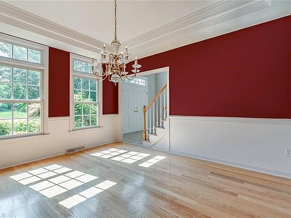 DINING ROOM LOCATED TO RIGHT OF FOYER WITH LOTS OF ROOM FOR ENTERTAINING, HOLIDAY MEALS,SPECIAL OCCASIONS, ETC.  NOTE THE HARDWO