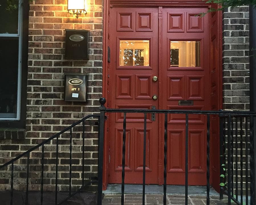 Front door of the building. Entrance to the upstairs apartment. Units have separate entrances.