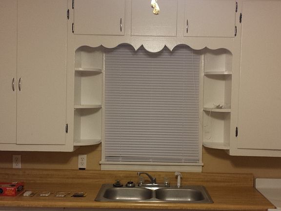 over sink window & upper cabinets
