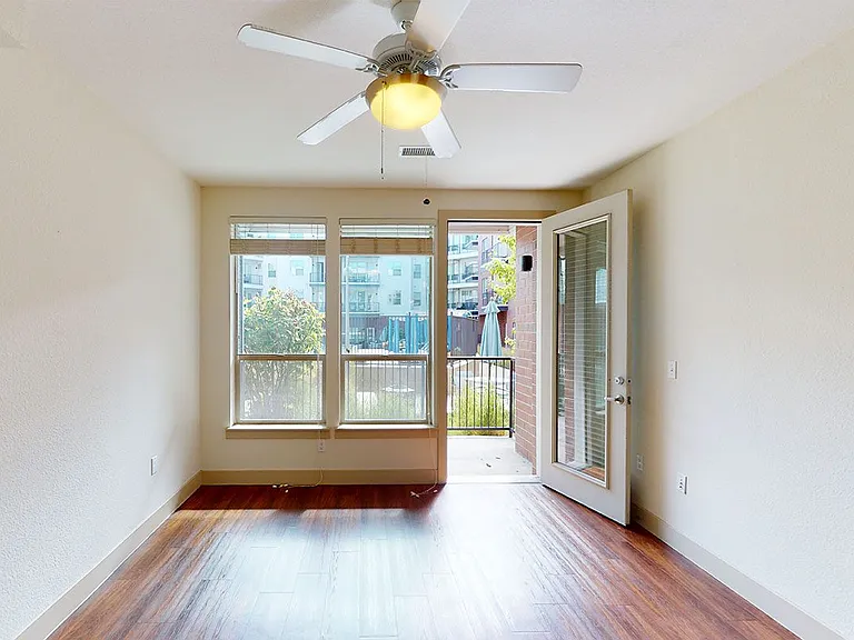 Apartment living room with wood-style flooring.