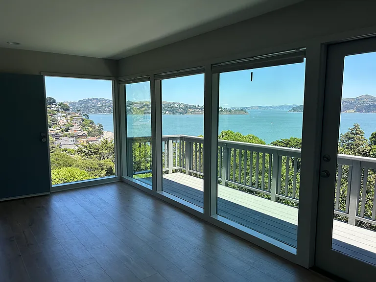 Floor to ceiling windows with bay views.