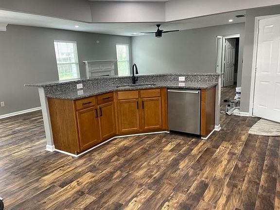 Stainless dishwasher, solid surface countertops, undermount sink.