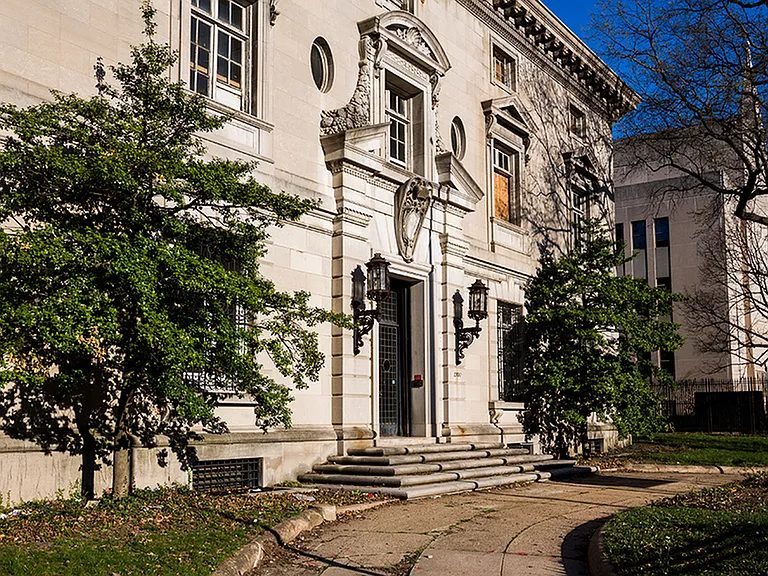Before: Exterior of leasing office featuring original architecture of the Italian Embassy