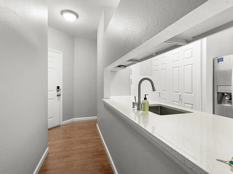 Welcoming entryway opens to the kitchen and main living space.