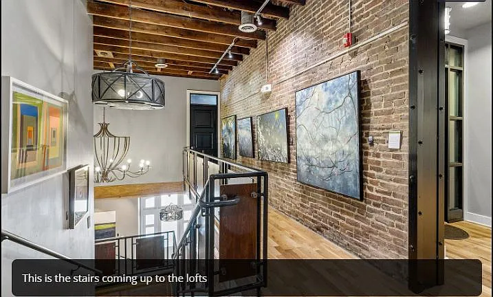 Walking outside your loft to lower level. The art is next level in this building!