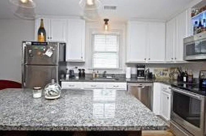 kitchen - refrigerator was replaced during the pandemic and is now white