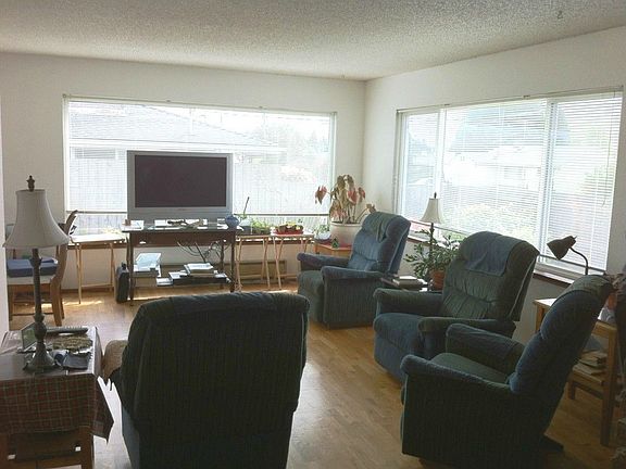 Open, bright living room with fireplace