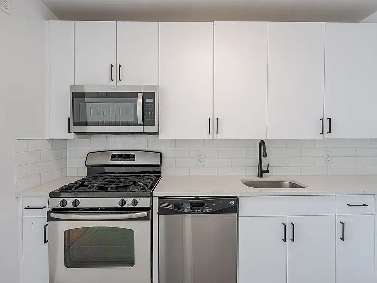 Sleek stainless steel appliances and modern cabinetry