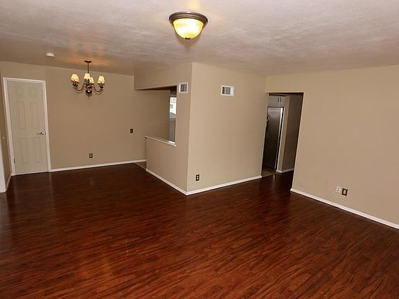 Dining area joins the living room and accesses the kitchen on the right, main floor family room to the left