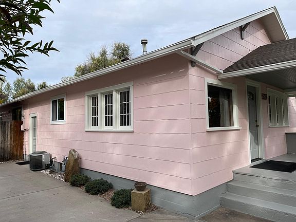 driveway for off-street parking and side entrance to kitchen
