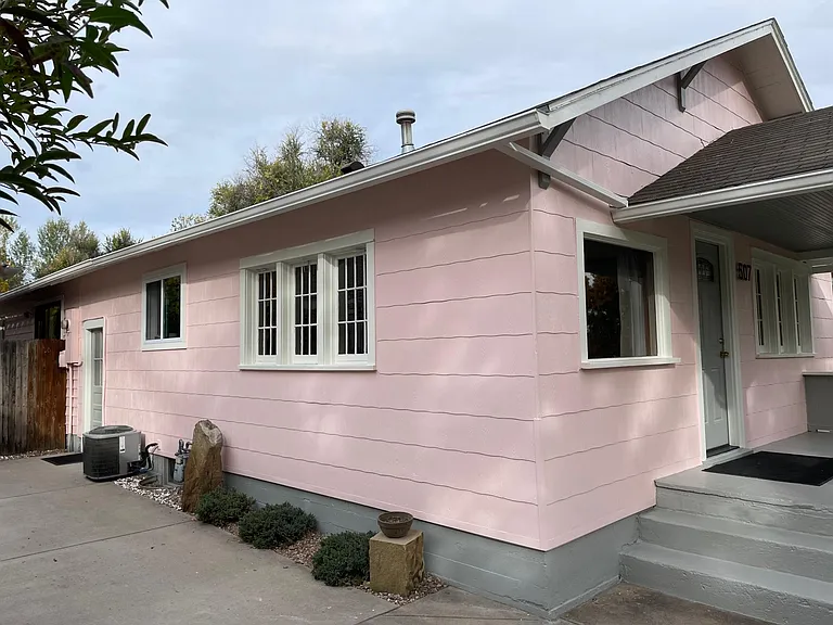 driveway for off-street parking and side entrance to kitchen