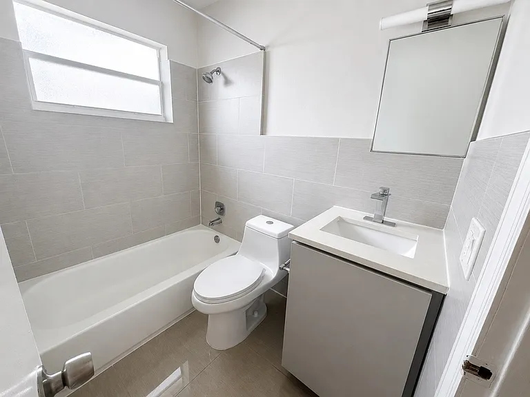 15 - Bathroom 1 - Tub, Toilet, and Vanity