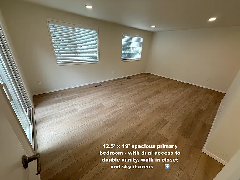 Your king sized bed can fit easily on any of 3 different walls-- with plenty of open space to spare! (Far wall, under the windows, or backing to vanity wall on the right side.)